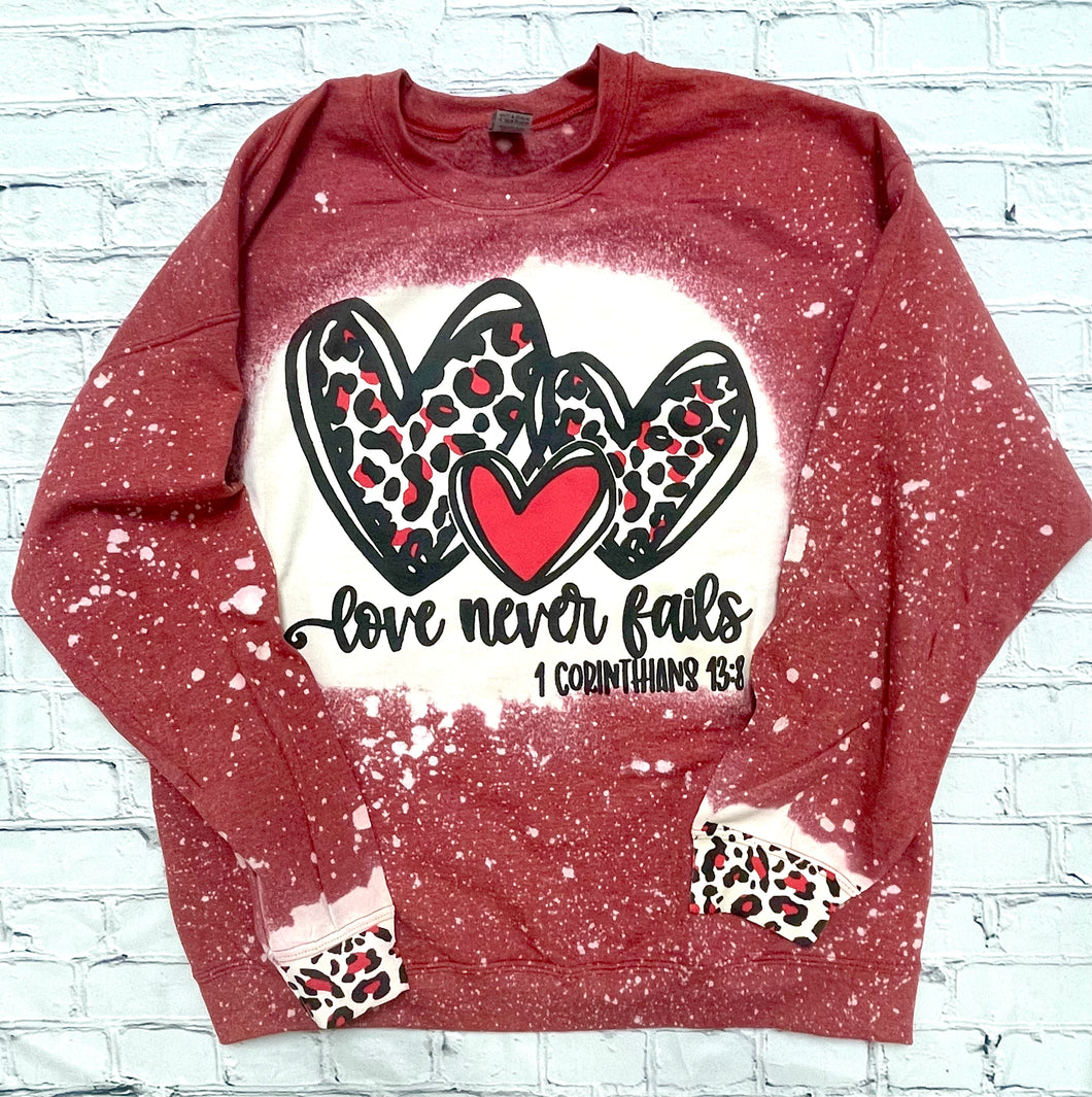 Love Never Fails Bleached Sweatshirt